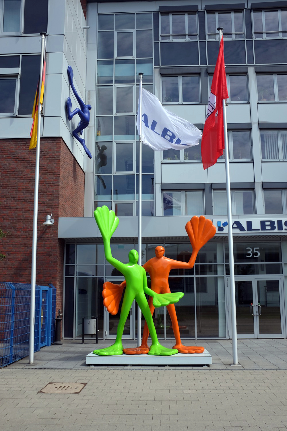 Frog figures in front of a company